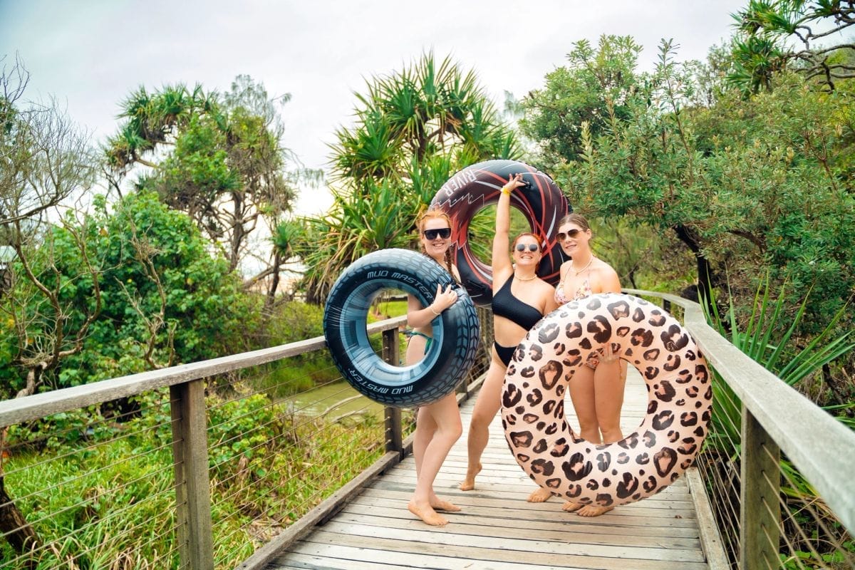 Travellers on a sunny East Coast beach in summer