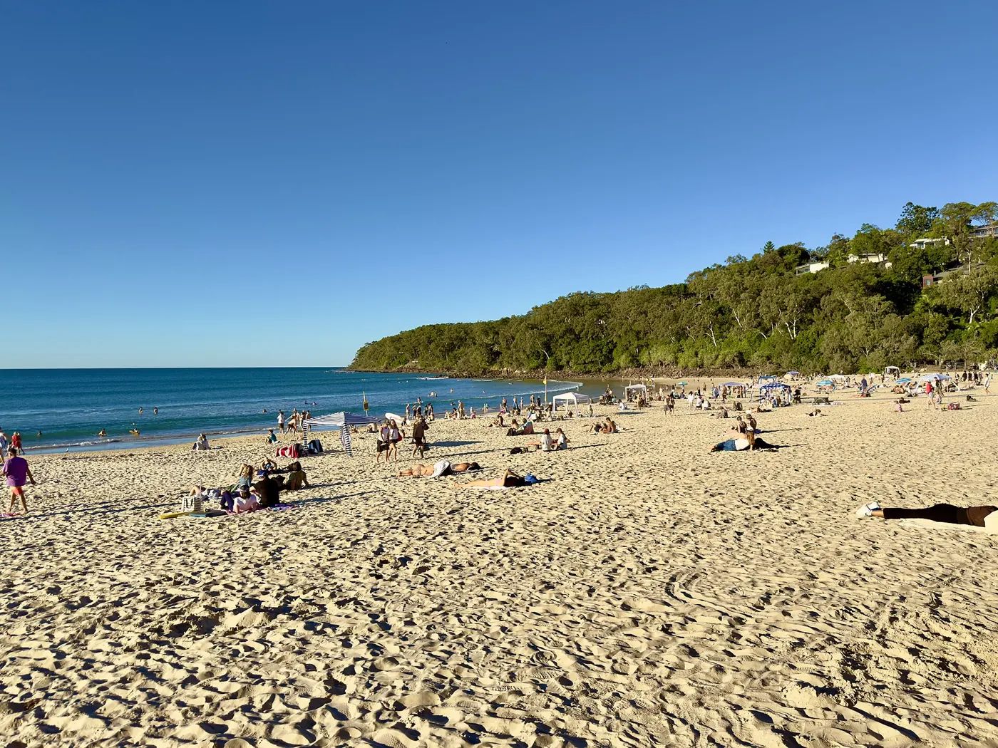 Noosa Main Beach and the national park headland on a clear day