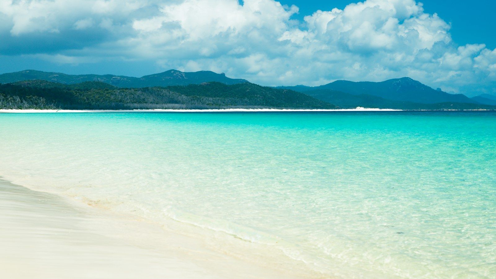 White sand and turquoise water of the Whitsunday Islands from above