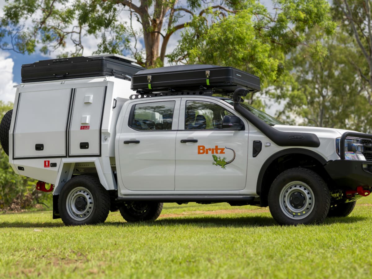 A 4WD campervan on an outback track