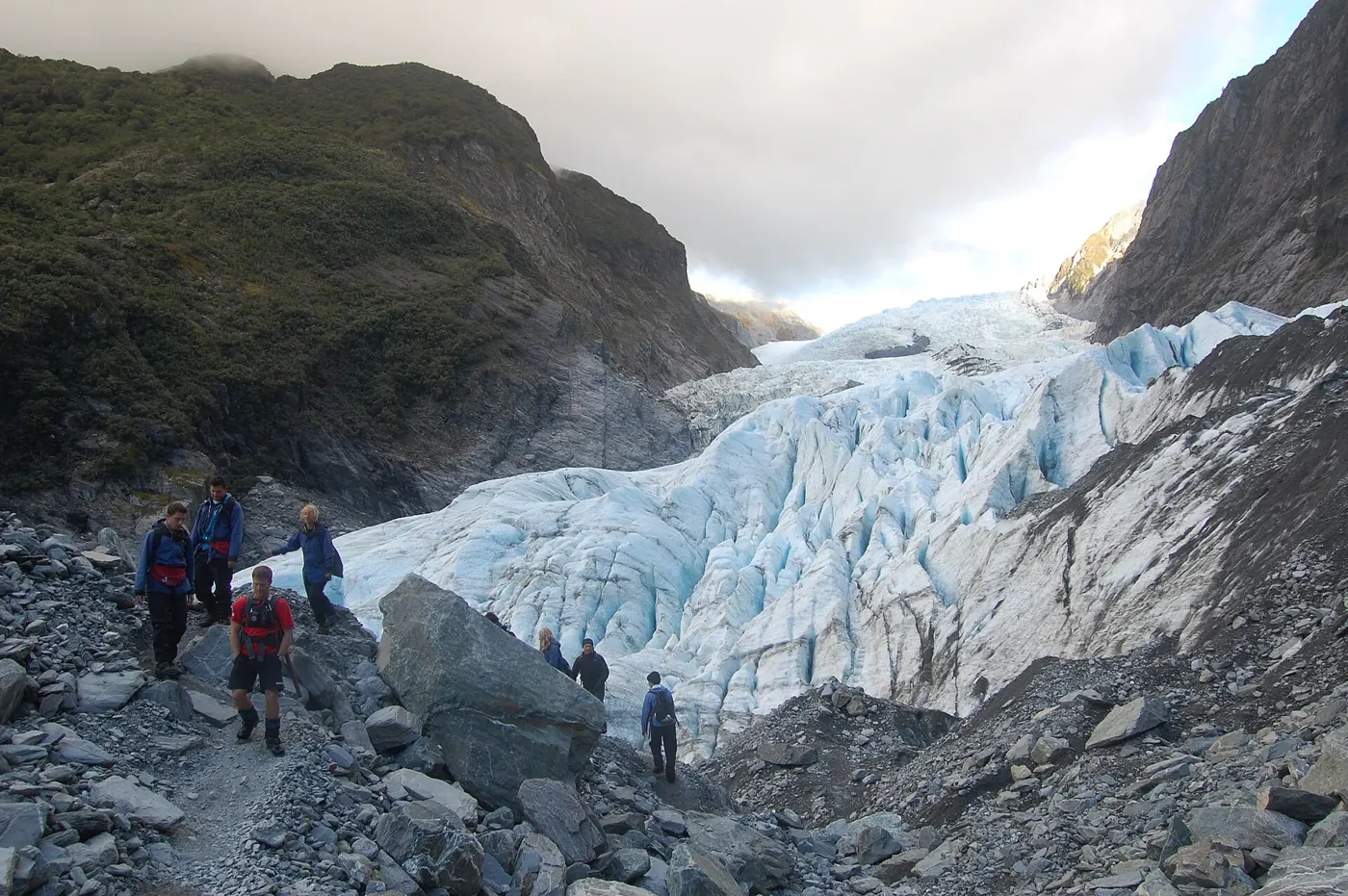 Walkers below Franz Josef Glacier
