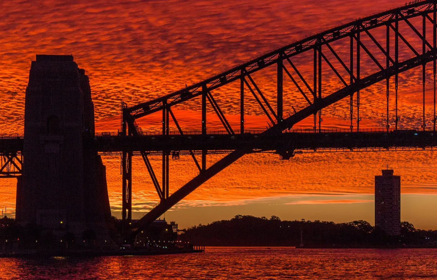 Sydney Harbour Bridge silhouetted at sunrise